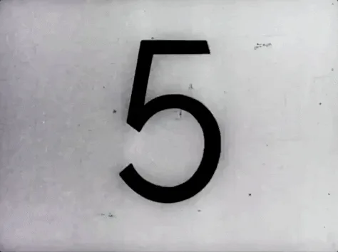 Black-and-white film countdown leader, numbers 5 to 2, ending in a black frame.