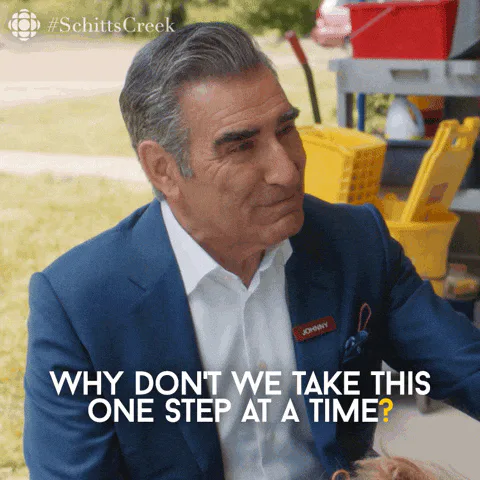 A man in a blue blazer says 'Why don't we take this one step at a time?' while standing outdoors.
