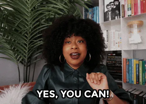 Tonight+Show+Yes+GIF+by+The+Tonight+Show+Starring+Jimmy+Fallon.gif A woman with curly hair pumps her fist in front of a bookshelf and plant, saying 'Yes, you can!'