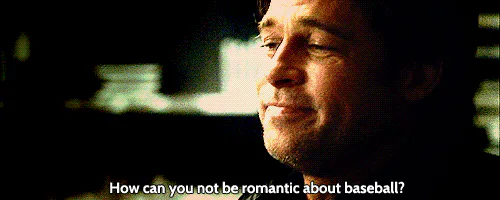 A man in a dark room says 'How can you not be romantic about baseball?'