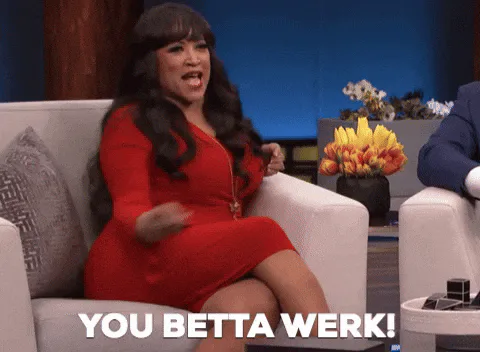 A woman in a red dress dances on a talk show couch, captioned 'You betta werk!'