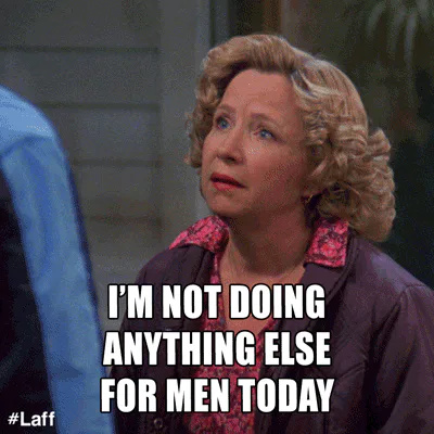 A woman with curly hair says 'I'm not doing anything else for men today.'