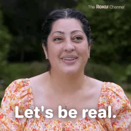 Be+Real+Season+2+GIF+by+The+Roku+Channel.gif A woman in a floral dress smiles outdoors and says 'Let's be real.'